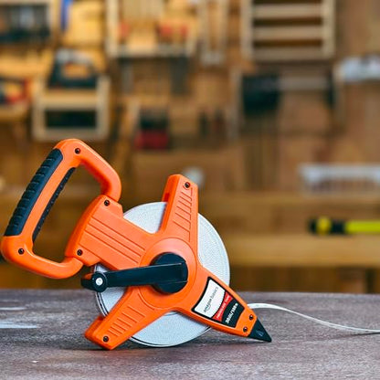 Amazon Basics Open Reel Fiberglass Measuring Tape, Versatile, Reliable, Shock-Absorbing Handle, Inch/Metric Scale, Impact Resistant Shell, 100-feet (30-Meters) by 1/2-Inch, Orange